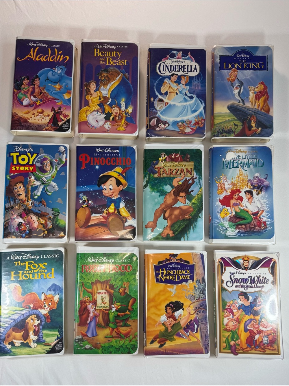 Vintage Walt Disney & Pixar Clamshell VHS Movie Lot - Set of 12 Tapes